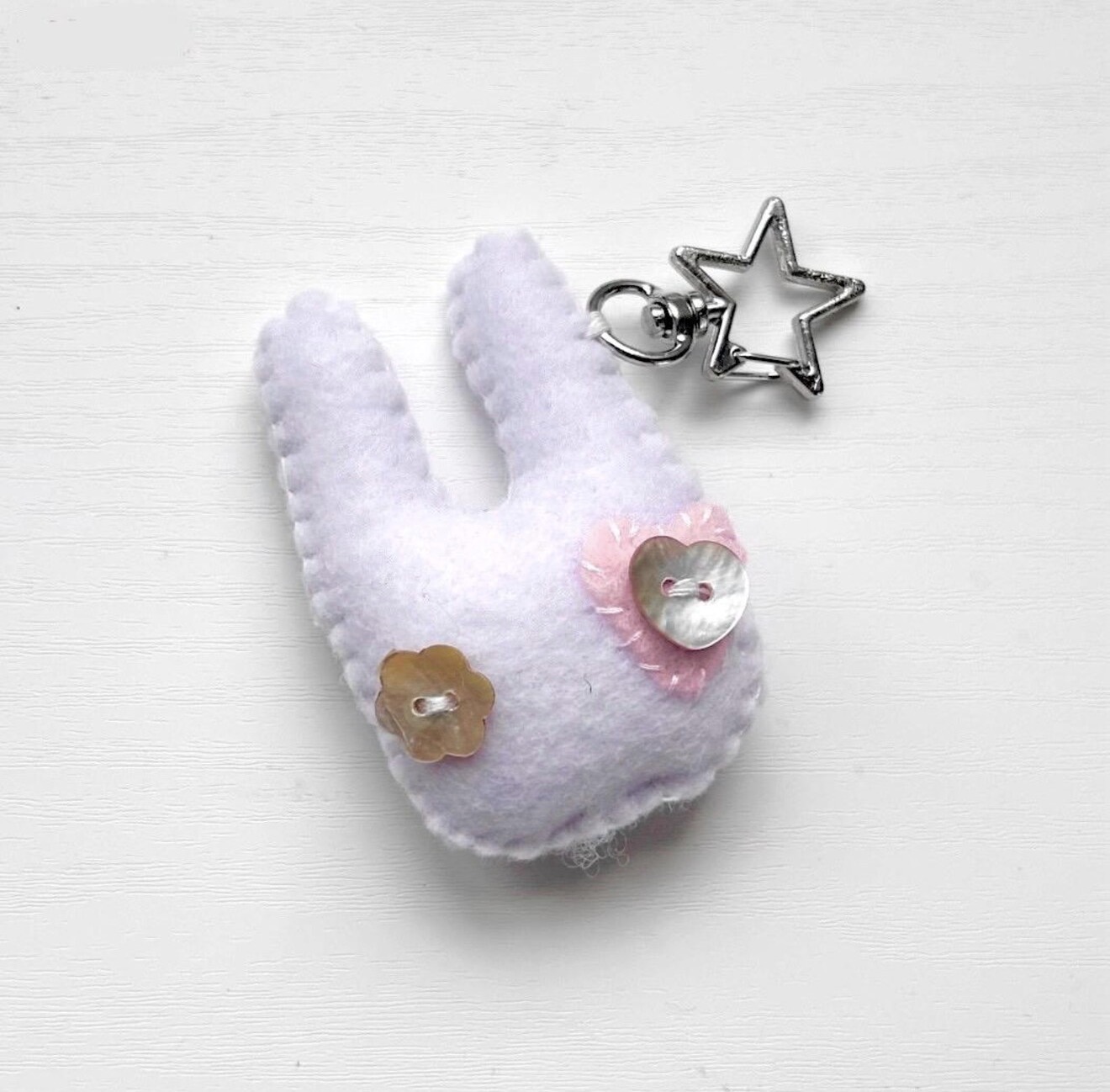 white handmade felt bunny keychain with button eyes